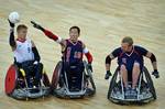 U.S. Navy retired William Groulx, U.S. Wheelchair Rugby Captain, plays defense against the Great Britain player during a match at the basketball arena during the London Paralympic Games, Sept. 5, 2012. The Paralympic Games are a major international multi-sport event where athletes with a physical disability compete; this includes athletes with mobility disabilities, amputations, blindness, and cerebral palsy. (U.S. Air Force photo by MSgt Sean M. Worrell)