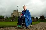 Australian wheelchair rugby star Greg Smith, Flag Bearer for the 2012 Australian Paralympic Team at the London 2012 Paralympic Games, wraps himself in the Australian flag