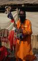 Indian Sadhu, or Hindu holy rest at a temporary camp at Babughat in Kolkata on 05 Jan 2012. Thousands of Hindu pilgrims taka holy dip at Gangasagar, hoping to wash away sins and others to secure a fine spouse, in a sun-worshipping tradition older than Hinduism itself in Eastern India City