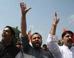 Jammu and Kashmir youth congress president Shahnawaz Choudhary with his party activists and Sarpanchs protest against state Government to fulfill their pending demands amendment in panchayati raj act in Srinagar on Friday 24, August 2012.