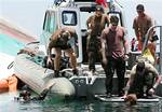 U.S. Navy divers conduct search and rescue operation for the sunken passenger ferry, MV Princess of the Stars, off Sibuyan Island in central Philippines on Wednesday June 25, 2008. Philippine officials suspended Friday June 27, 2008 the search and retrieval of hundreds of bodies believed still trapped inside the sunken ferry following revelation that 22,000 pounds (10,000 kilograms) of toxic chemicals, Endosulfan, a pesticide intended for pineapple plantations of Del Monte Philippines, went down