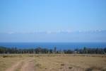 Tamchy skyline, seen from the plain a few kilometers inland. Another ridge of the Tian Shan is seen beyond the lake, maybe some 100 km to the south Terskey Alatoo range seen from across Lake Issyk Kul