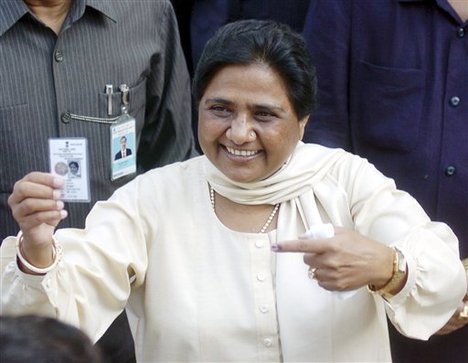 Uttar Pradesh state Chief Minister Mayawati displays her voter’s identity card and the indelible ink mark on her finger after casting her vote in Lucknow, India, Thursday, April 30, 2009. The third phase of the five-phased Indian general elections is being held Thursday