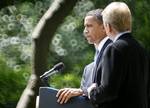 President Barack Obama, accompanied by BP Oil Spill Commission Co-Chairs former Florida Sen. Bob Graham, D-Fla., left, and former EPA Administrator William Reilly, right, speaks in the Rose Garden of the White House in Washington, Tuesday, June 1, 2010.