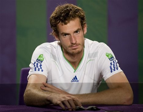 Britain's Andy Murray answers questions at a press conference following his loss to Spain's Rafael Nadal in their men's semifinal match at the All England Lawn Tennis Championships at Wimbledon Friday, July 1, 2011.