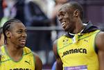 Jamaica's Usain Bolt, right, celebrates winning gold in the men's 100-meter final alongside silver medallist Yohan Blake of Jamaica during the athletics in the Olympic Stadium at the 2012 Summer Olympics, London, Sunday, Aug. 5, 2012.