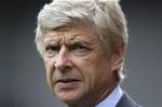 Arsenal's manager Arsene Wenger takes to the touchline before his team's English Premier League soccer match against Stoke at Britannia Stadium, Stoke, England, Sunday, Aug. 26, 2012.