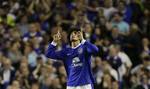 Everton's Marouane Fellaini celebrates after scoring against Manchester United during their English Premier League soccer match at Goodison Park Stadium, Liverpool, England, Monday, Aug. 20, 2012.