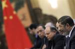 Egypt's President Mohammed Morsi speaks to his Chinese counterpart Hu Jintao, not in photo, during their meeting at the Great Hall of the People in Beijing, China