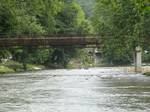 Walking bridge over the Oconaluftee River in Cherokee. Cherokee (ᏣᎳᎩ in Cherokee language) is a town in Swain County in western North Carolina, USA, within the Qualla Boundary land trust.