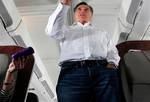 Republican presidential candidate, former Massachusetts Gov. Mitt Romney talks to reporters on his campaign plane en route from Tampa, Fla. to Minnesota and Nevada, Wednesday, Feb. 1, 2012. (AP Photo/Gerald Herbert)