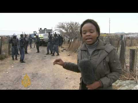 South African police raid striking miners; updated 16 Sep 2012; published 15 Sep 2012