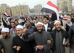 Egyptian anti-government protester sheiks of al Azhar, the highest Islamic sunni institute, march in Tahrir Square in Cairo, Egypt, Monday, Feb. 7, 2011. The protests, which saw tens of thousands of people massing daily in downtown Cairo for demonstrations that at times turned violent, have raised questions about the impact on the economy. More than 160,000 foreign tourists fled the country in a matter of days last week, in an exodus sure to hammer the vital tourism sector.