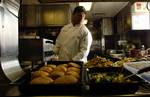 NEW YORK, NY (March 22, 2006)--Food Service Specialist Second Class Martin Espinoza makes sure the noon meal is satisfactory before serving the crew of the Coast Guard Cutter Sturgeon Bay, homeported in Bayonne, NJ, while on patrol in New York Harbor Wednesday, March 22, 2006. USCG photo by PAC Tom Sperduto (105376) ( STURGEON BAY UNDERWAY (FOR RELEASE) )