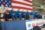 NASA's Johnson Space Center (JSC) director Michael L. Coats addresses a large crowd of well-wishers at the STS-128 crew return ceremony on Sept. 12, 2009 at Ellington Field near JSC. Also pictured (from the second left) are NASA astronauts Rick Sturckow, commander; Kevin Ford, pilot; Patrick Forrester, Jose Hernandez, John 