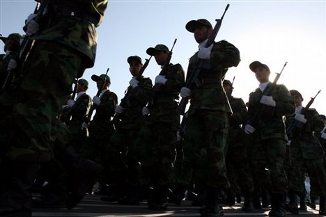 ** FILE ** Members of Iranian Corps Guards of the Islamic Revolution forces parade during large-scale military parades in Tehran to mark the 27th anniversary of the Iraqi invasion of Iran that sparked the bloody 1980-88 war, in Tehran, Iran in this photo taken on Saturday Sep. 22, 2007.