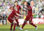 FC Rubin Kazan's Obafemi Martins, right, reacts with Vitali Kaleshin,left, after scoring a goal against Shamrock Rovers during their Europa League Group Stage soccer match at Tallaght Stadium, Dublin, Ireland, Thursday, Sept. 15, 2011.