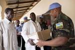 12 August 2012. Kutum: (from right to left) UNAMID Force Commander Patrick Nyamvumba hands out medical supplies donated by UNAMID to doctor Noreldeen Adam, director of the Rural Hospital in Kutum, North Darfur, and Mustafa Bakhit, the Deputy Commissioner of Kutum. Photo by Sojoud Elgarrai UNAMID