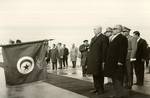 The first Tunisian President Habib Bourguiba paying tribute to Tunisian national flag.