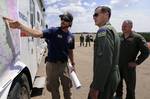 Lt. Gen. Stanley E. Clarke III, commander Continental U.S. North American Aerospace Defense Command Region receives a briefing from the U.S. Forest Service's Justin Jager, the helibase manager at the U.S. Air Force Academy's airfield about fireighting efforts June 28, 2012 in Colorado Springs, Colo. All Waldo Canyon fire helicopter operations are operating from the Academy's airfield. The Fire iis currently 30% contained. (U.S. Air Force photo/Mike Kaplan)