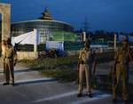 Indian policemen stand outside a Hajhouse in Srinagar on September 17, 2012. The first batch of 279 Kashmiri Hajj pilgrims set off for the annual trip. Some 34,000 Hajj travel applications were received for this year's pilgrimage season, with 8700 pilgrims selected for the journey.