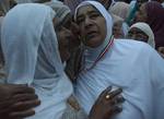 Relatives of a Kashmiri Hajj pilgrim kisses her as she departs for the annual Hajj pilgrimage on September 17, 2012 in Srinagar, the summer capital of Indian administered Kashmir, India.The first batch of 269 Kashmiri Muslim Hajj pilgrims has left for the Holy Makkah in Saudi Arabia to perform annual Hajj pilgrimage