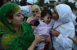 Kashmiri Hajj pilgrim kisses children as she departs for the annual Hajj pilgrimage on September 17, 2012 in Srinagar, the summer capital of Indian administered Kashmir, India.The first batch of 269 Kashmiri Muslim Hajj pilgrims has left for the Holy Makkah in Saudi Arabia to perform annual Hajj pilgrimage