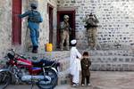 U.S. soldiers assigned to A Battery, 2nd Battalion, 377th Parachute Field Artillery Regiment, Task Force 4-25, and the Afghan Uniformed Police search the village of Loy Murghoz for weapon caches in Khowst province, Afghanistan, June 8, 2012.