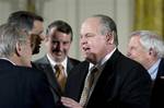 Conservative talk radio host Rush Limbaugh talks with former Defense Secretary Donald H. Rumsfeld, left, in the East Room of the White House in Washington, Tuesday, Jan. 13, 2009, as they arrived for the Presidential Medal of Freedom ceremony for Colombian President Alvaro Uribe, former British Prime Minister Tony Blair and former Australian Prime Minister John Howard. From left to right are: Rumsfeld, Sen. Mel Martinez, R-Fla., Edward W. Gillespie, counselor to President George W. Bush and a fo