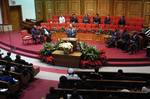 This African-American Primitive Baptist church in Florida is an exception to the usual practice[8] of excluding musical instruments: a piano and organ are visible.