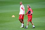 Benfica manager Jorge Jesus, right, and Luisao, left, are seen during their training session at Celtic Park, Glasgow, Scotland, Tuesday Sept. 18, 2012. Benfica will play Celtic in a Champions League Group G soccer match on Wednesday.