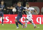 Paris Saint Germain's Italian player Marco Verratti, left, and Toulouse's Wissam Ben Yedder challenge for the ball during a League One soccer match at Parc des Princes stadium in Paris, Friday, Sept. 14, 2012.