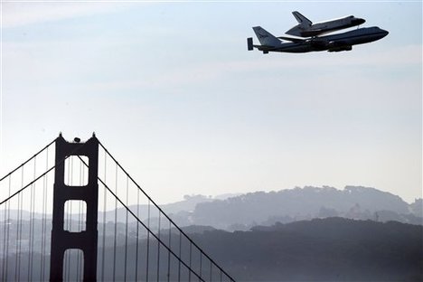 Space Shuttle Endeavour mounted on NASA's Shuttle Carrier Aircraft, passes over the Golden Gate Bridge in San Francisco, Friday, Sept. 21, 2012