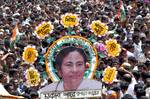 Trinamool Congress Supporters holding a poster of West Bengal Chief Minister Mamata Banerjee during the Shaheed Diwas rally in Kolkata on Saturday to commemorate killing of 13 Youth congress activities in a police fireing in 1993 21 July 2012