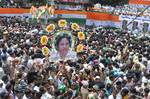 Trinamool Congress Supporters holding a poster of West Bengal Chief Minister Mamata Banerjee during the Shaheed Diwas rally in Kolkata on Saturday to commemorate killing of 13 Youth congress activities in a police fireing in 1993 21 July 2012