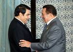 Tunisian President Zine El Abidine Ben Ali greets his Egyptian counterpart Hosni Mubarak, upon his arrival at the congress palace Saturday May 22, 2004 in Tunis. Tunis hosts a two-day 16th ordinary session of Arab Summit to discuss the situation in Iraq, the recent escalation of violence in the Palestinian territories and reforming of the Arab League as well as a response to a U.S. proposal for political reform in the Middle East.