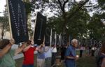 Mourners take part in a candle light vigil for the victims of the Sikh Temple of Wisconsin shooting in Milwaukee Sunday, Aug 5, 2012.