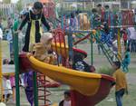 Kashmiri children enjoy the amusement rides laid on especially for the Eid-Al-Fitr celebration in Srinagar Children Park on August 21, 2012. Second day of a three day holiday signaling the end of Ramadan, Islam's holiest month.