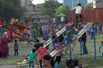 Kashmiri children enjoy the amusement rides laid on especially for the Eid-Al-Fitr celebration in Srinagar Children Park on August 21, 2012. Second day of a three day holiday signaling the end of Ramadan, Islam's holiest month.