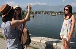 Tourists enjoy Banks of Dal Lake in Srinagar, India, on 03, September 2012.