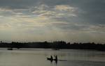 Amidists a spell of rains in Srinagar on Saturday on 25, August 2012. People enjoy shikara ride waters of Dal lake.