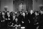 President Johnson signs the Civil Rights Act of 1964. Among the guests behind him is Martin Luther King, Jr. In conjunction with the civil rights movement, Johnson overcame southern resistance and convinced Congress to pass the Civil Rights Act of 1964, which outlawed most forms of racial segregation.