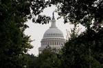 In this July 29, 2008 file photo, the dome of the Capitol in Washington is framed through summer foliage, in Washington. Two sitting U.S. senators _ neck-deep in the American political establishment _ are running for president as anti-Washington outsiders. Puzzling? Not if you're familiar with the classic Hollywood western _ the lone sheriff riding to the rescue of an outlaw-ridden frontier tow