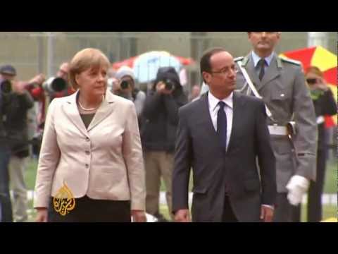 Hollande vows to work with Merkel