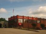 The Minden Coca-Cola Bottling Plant is a distribution center on Pine Street across from Minden Cemetery, U.S.