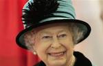 Britain's Queen Elizabeth II smiles during a visit to the new Coca Cola factory, which she officially opened in Lisburn, Northern Ireland, Friday, Oct. 22, 2010.