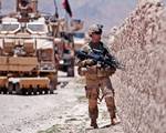 U.S. Army Spc. Shane Storey, a squad automactic weapon gunner with the 82nd Airborne Division's 1st Brigade Combat Team, pulls security while his platoon sweeps a road for mines June 30, 2012, near Muqor, Ghazni Province, Afghanistan. He is armed with an M249 squad automatic weapon. (U.S. Army photo by Sgt. Michael J. MacLeod, Task Force 1-82 PAO)