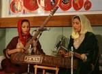 Kashmiri musicians clad in traditional attire perform during a two-day music festival in Srinagar on June 18, 2011. The tourism industry is hoping that the cool summer weather will herald a renewal of tourists to the scenic region after last years civil unrest had driven both domestic Indian and foreign tourists out of the valley.