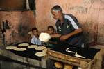 A Palestinians bake bread at a traditional bakery in the Palestinian Rafah refugee camp, in the southern Gaza Strip on September 24, 2012. 