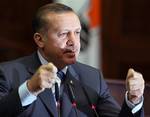 Turkey's Prime Minister Tayyip Erdogan addresses the lawmakers of his ruling party at the parliament in Ankara, Turkey, Tuesday, April 29, 2008. Turkish legislators prepared Tuesday to debate a proposal to soften a law restricting freedom of speech that has been used to prosecute Nobel prize winner Orhan Pamuk and other intellectu